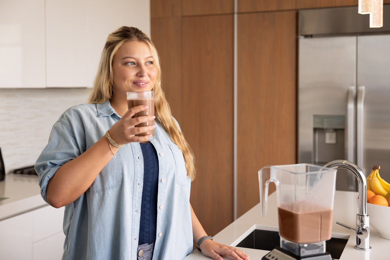 Woman enjoying Formula 1 shake
