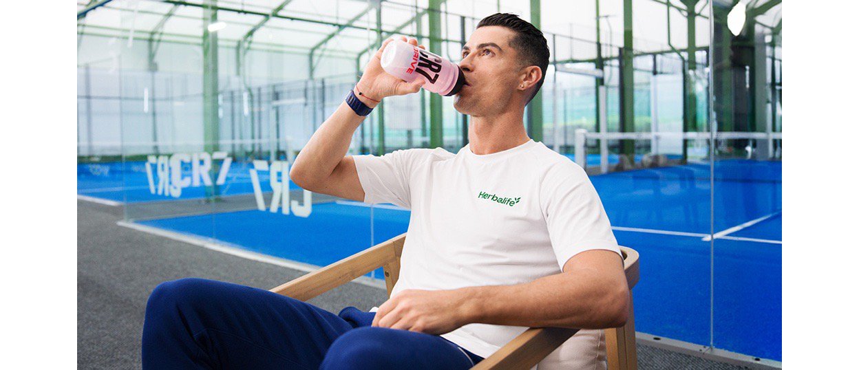 Cristiano Ronaldo drinking CR& from a bottle