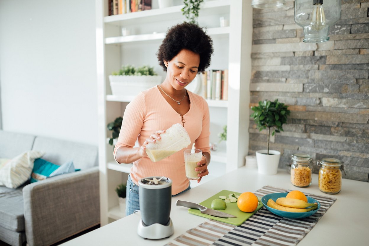 A woman enjoying a health shake as part of a nutritious diet.